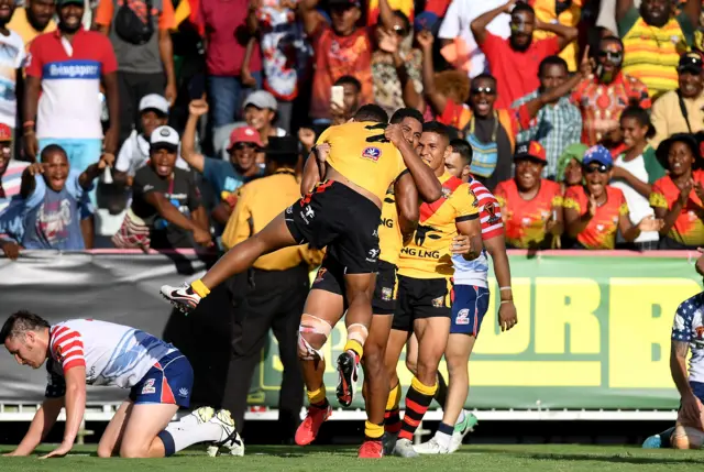 Papua New Guinea celebrate a try versus the USA