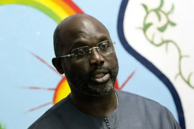 George Weah, presidential candidate for the Coalition for Democratic Change(CDC), speaks to journalists at the party headquarters in Monrovia, Liberia, 25 October 2017.