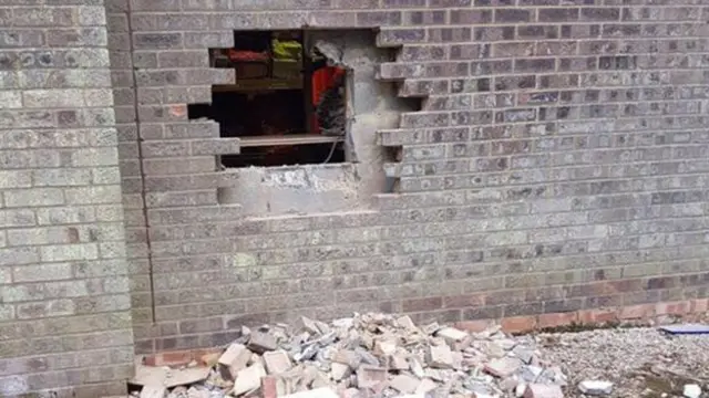 The hole in the brick wall of V&J Knitwear