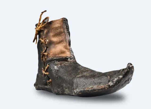 The left shoe dating back to the 1500s