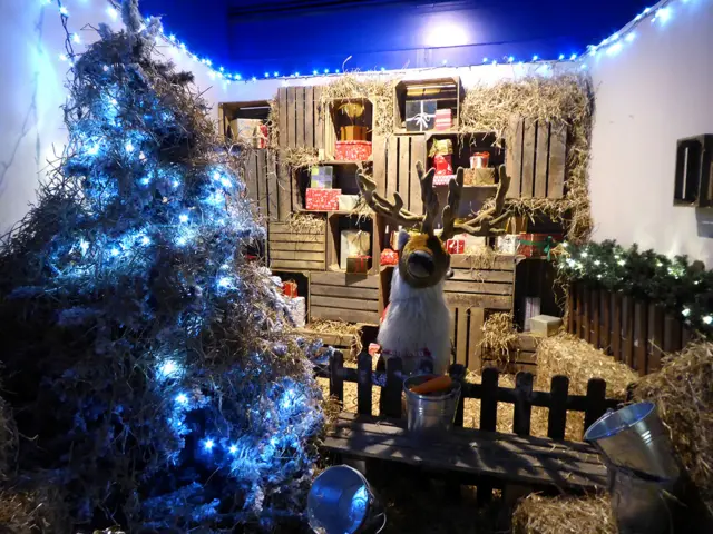 The store's Christmas grotto featuring a large toy reindeer