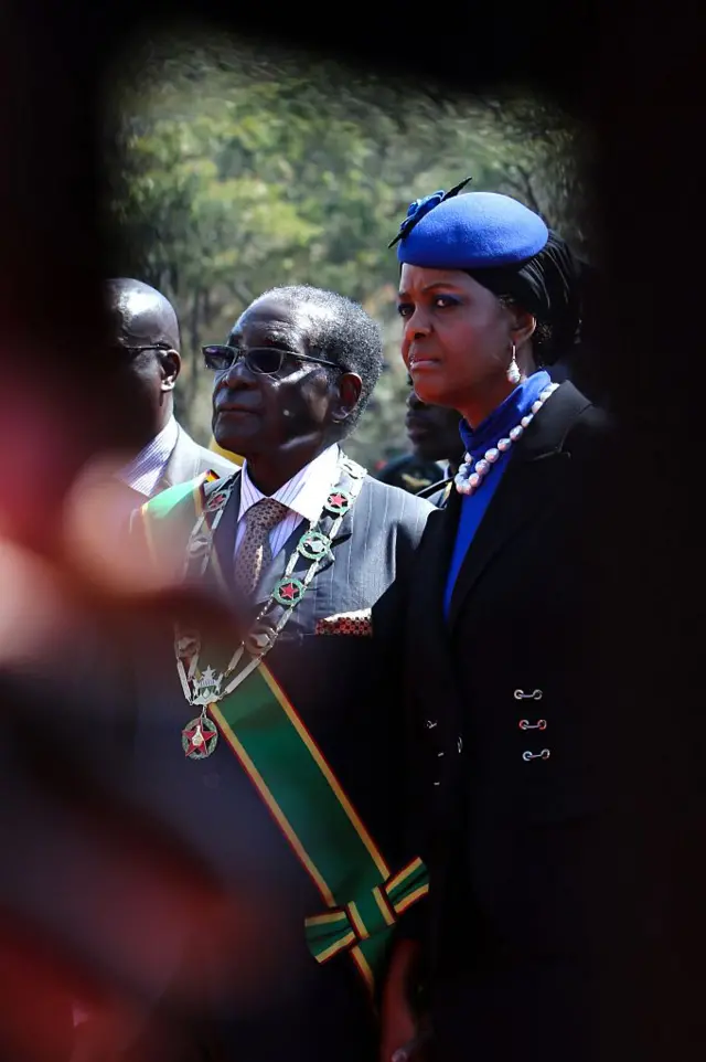 Zimbabwe's President Robert Mugabe (L) and his wife Grace stand by the monument of the Unknown Soldier during Heroes Day commemorations in Harare on August 10, 2015. Zimbabwe's President Robert Mugabe on August 10 criticized the killing of Cecil the Lion, saying the animal was a key part of the country's heritage