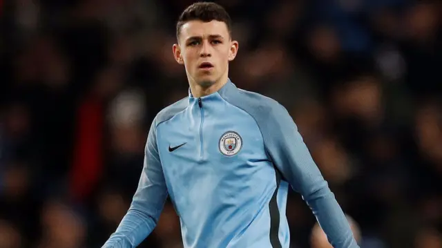 Phil Foden warms up