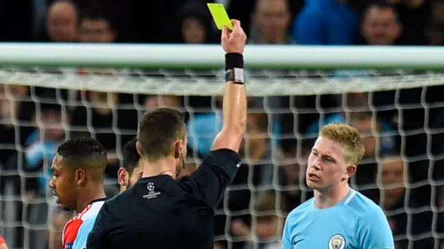 Kevin De Bruyne is shown a yellow card