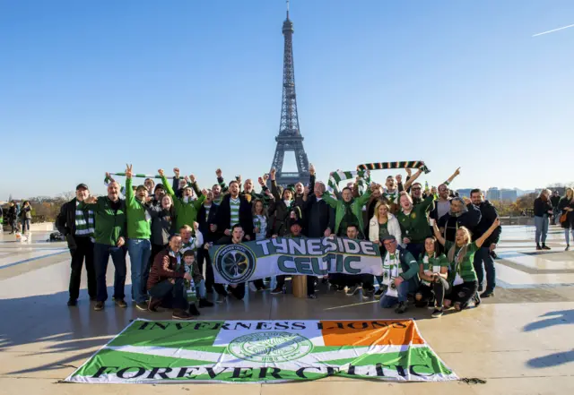 Celtic fans pose for photos at the Eiffel Tower