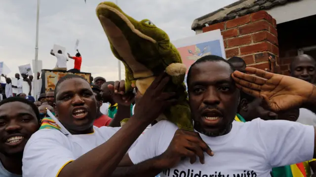 Zanu-PF supporters with a toy crocodile, Harare, Zimbabwe - Wednesday 22 November 2017