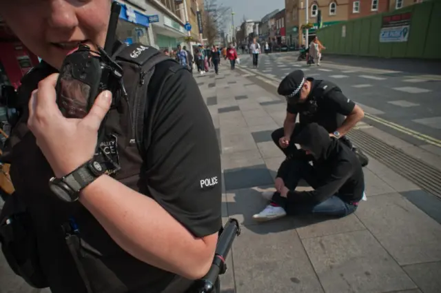 Police attending to a member of the public