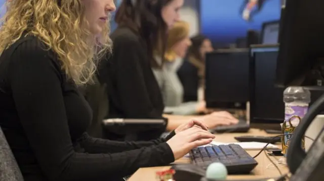 Women typing on computers