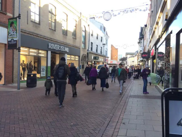 People walking through Ipswich town centre