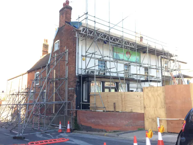 Scaffolding outside the former Rose and Crown pub