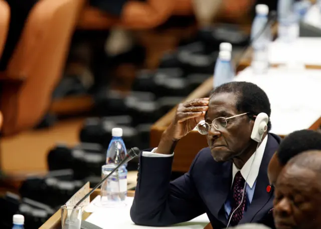 Zimbabwe"s President Robert Mugabe closes his eyes