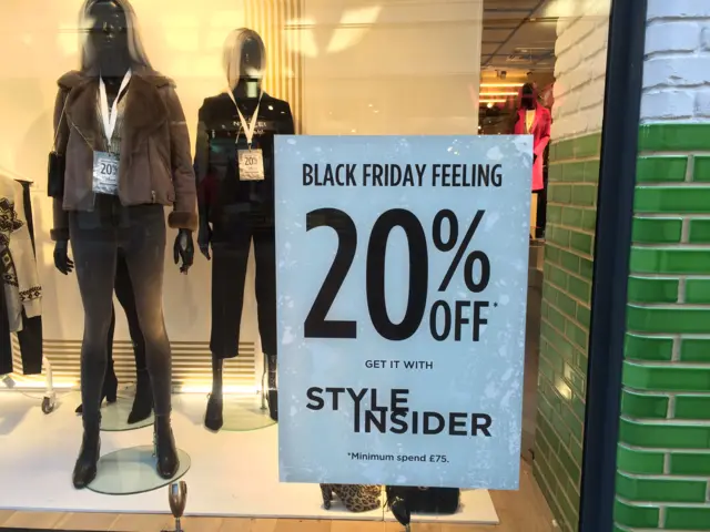 20% off sign in shop window