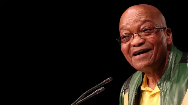 Jacob Zuma smiles against a black background in this July 2017 file photo