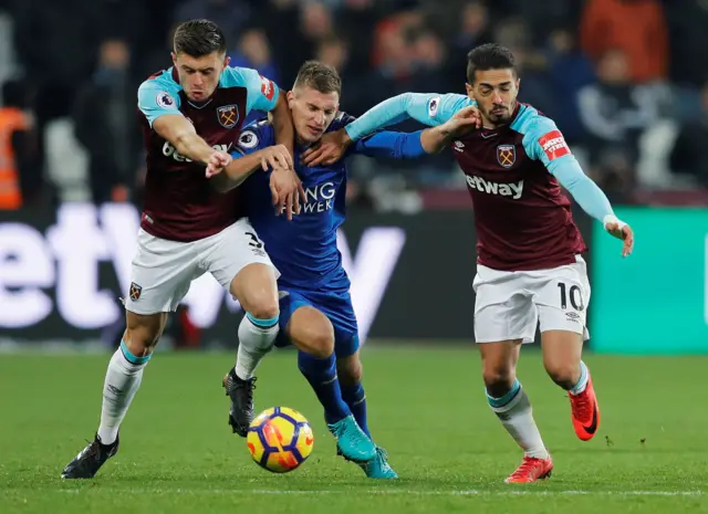 Marc Albrighton in action with West Ham United"s Manuel Lanzini and Aaron Cresswell