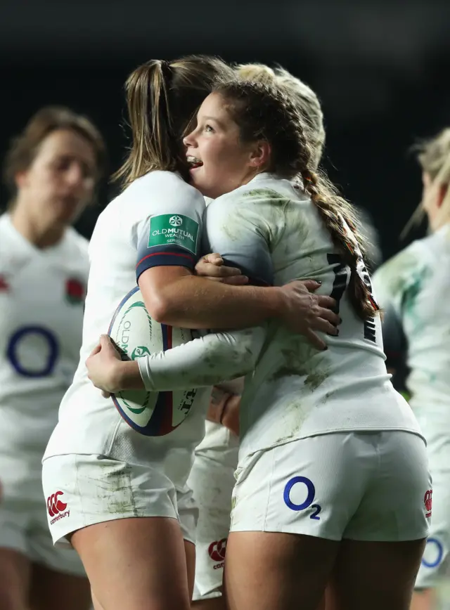 Jess Breach of England celebrates scoring a try