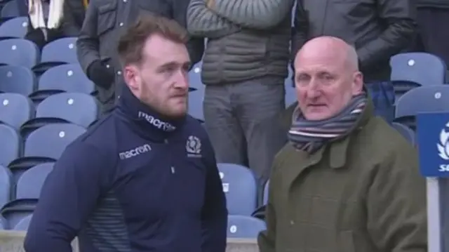 Stuart Hogg looks downcast with his dad during the warm-up