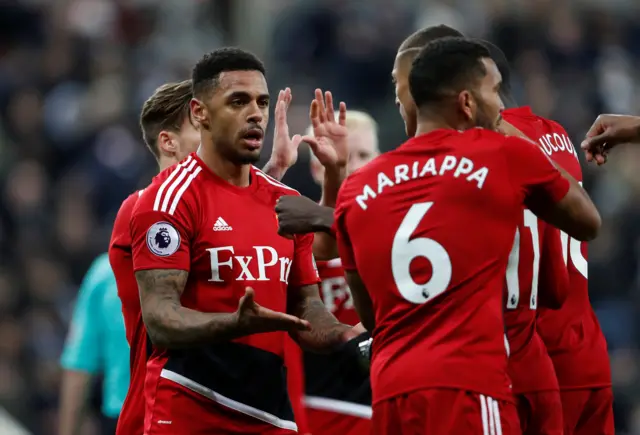 Andre Gray celebrates his goal