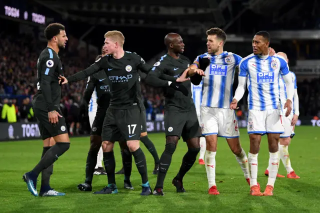 City and Huddersfield players disagree on the pitch