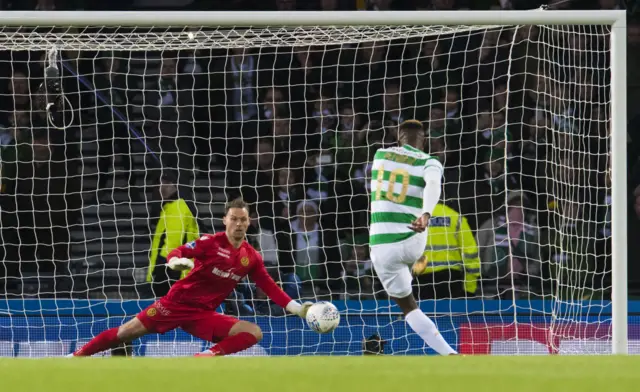 Moussa Dembele tucks away the penalty kick