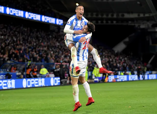 Tom Ince and Christopher Schindler of Huddersfield Town celebrat