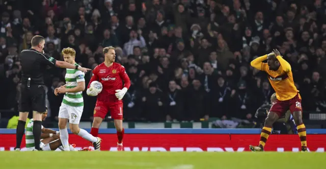 Referee Craig Thomson points to the penalty spot