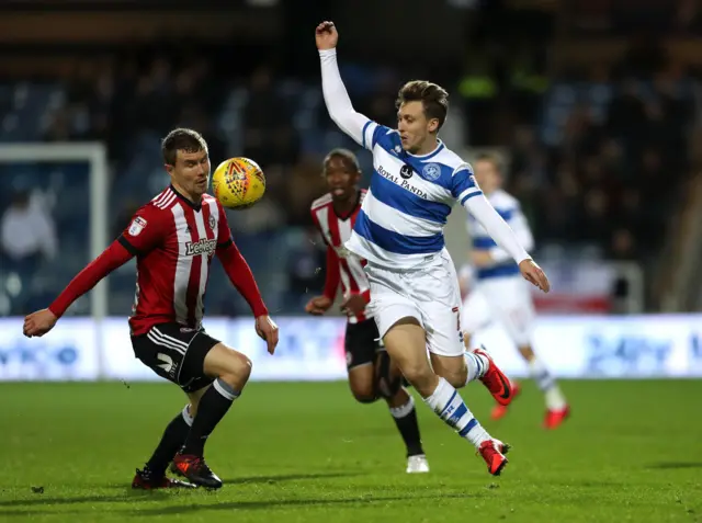 QPR's Luke Freeman (right) and Brentford's Andreas Bjelland