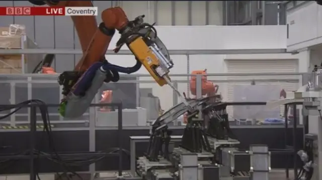 Multitasking robot in Coventry creating a door panel