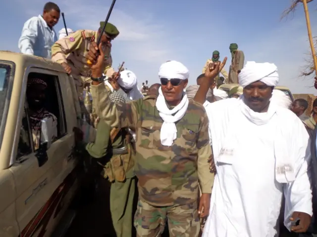 ws Musa Hilal (C), the leader of the Arab Mahamid tribe in Darfur, saluting his followers upon his arrival in Nyala, the capital of South Darfur state in 2013