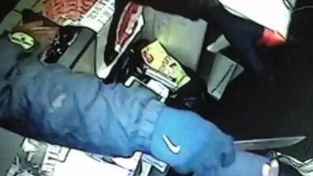 CCTV of glove with knife