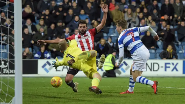 Luke Freeman of QPR scores a goal past Brentford goalkeeper Daniel Bentley