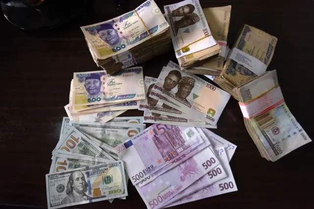 Bank notes in naira, dollars, euros and pounds sterling are pictured in Lagos, on January 26, 2016