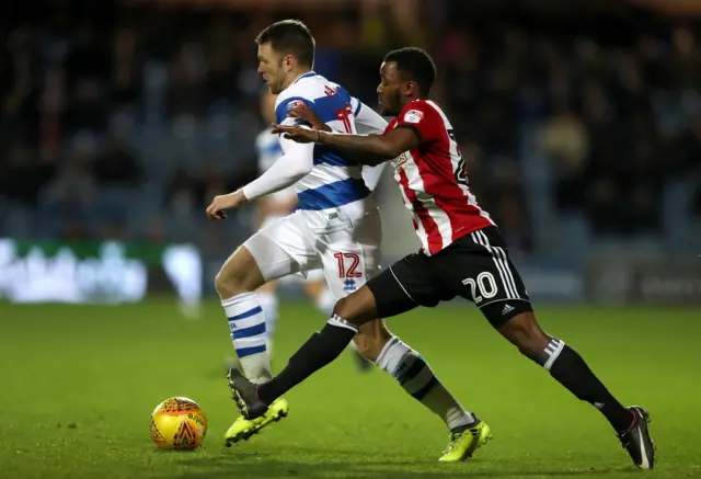Queens Park Rangers' Jamie Mackie (left) and Brentford"s Josh Clarke