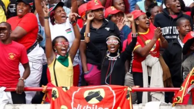 People cheer as they wait for the inauguration ceremony to swear in Kenya"s President Uhuru Kenyatta at Kasarani Stadium in Nairobi, Kenya November 28, 2017