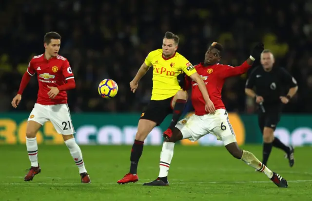 Tom Cleverley competes with Paul Pogba for the ball