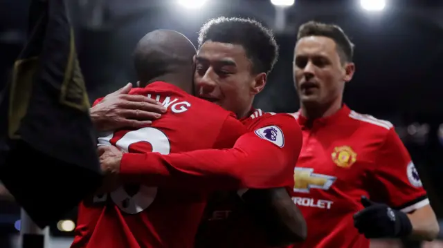 Ashley Young celebrates with Jesse Lingard