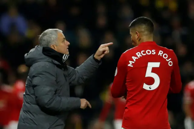 Jose Mourinho gives instructions to Marcos Rojo