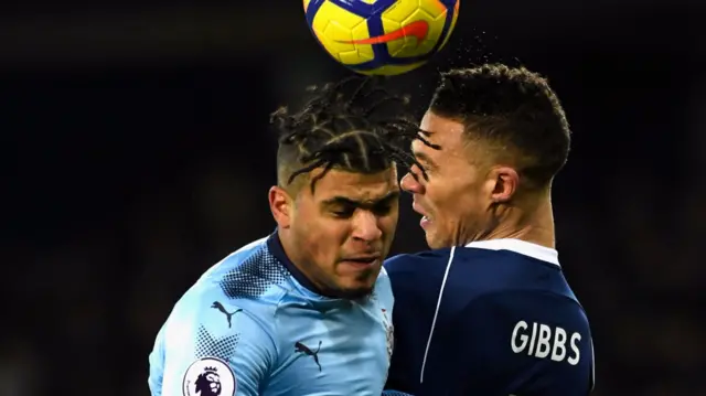 DeAndre Yedlin and Kieran Gibbs compete for the ball