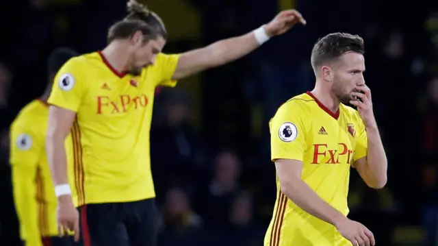 Watford's players react after going 2-0 down