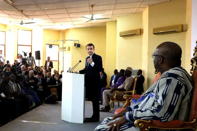 French President Emmanuel Macron (C) speaks at the Ouagadougou University, in Ouagadougou, on November 28, 2017