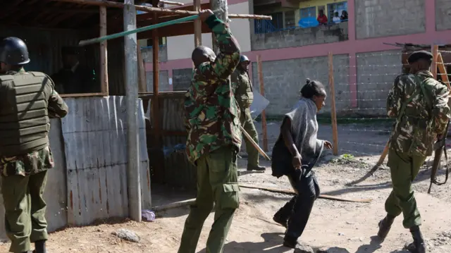 An opposition supporter is beaten by police in Nairobi, Kenya, 28 November 2017