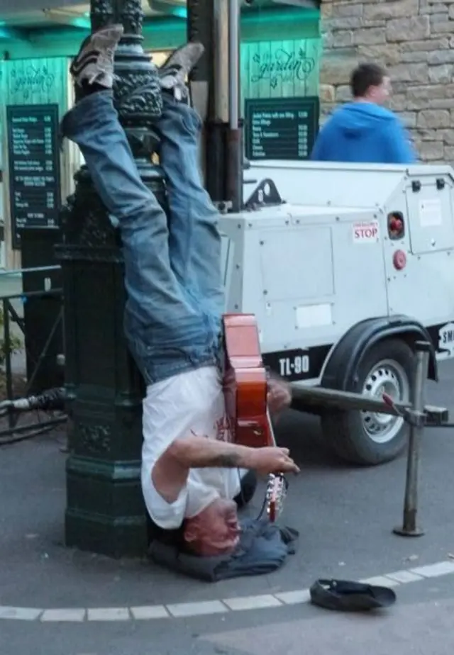 Upside down busker in Borunemouth