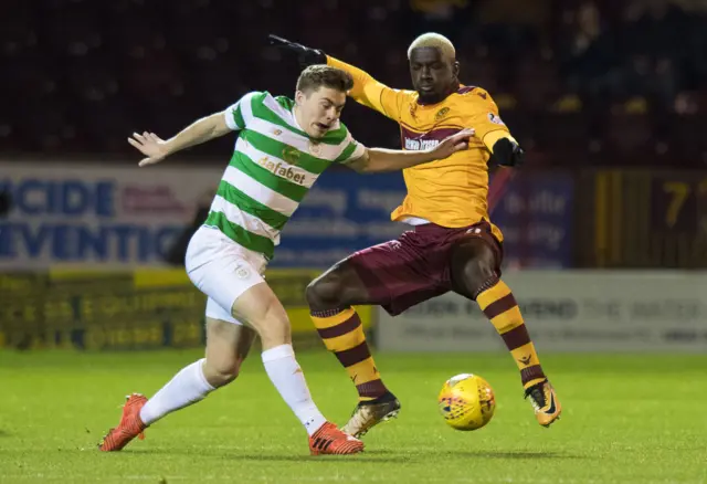 James Forrest is challenged by Motherwell centre-back Cedric Kipre