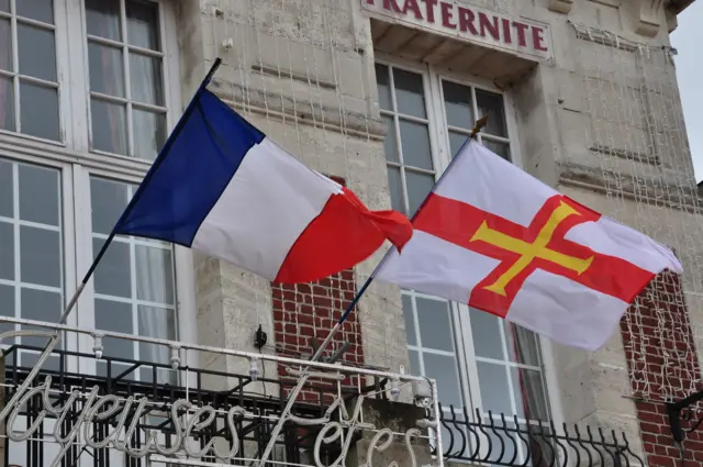 French and Guernsey flags flying outside the Masnieres Town Hall