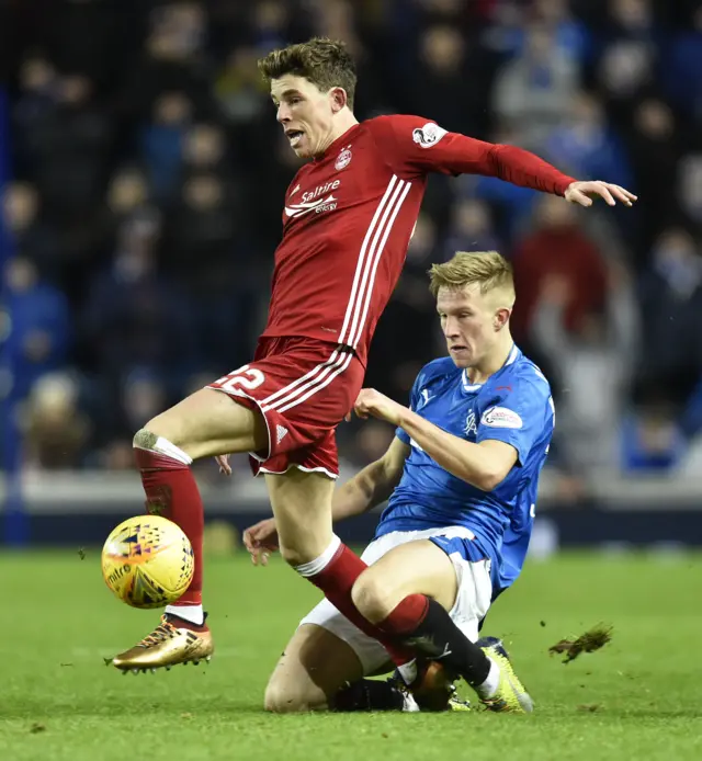 Ross McCrorie tackles Ryan Christie