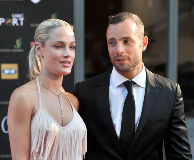 This file photo taken on November 4, 2012 shows South Africa"s Olympic sprint star Oscar Pistorius and his late model girlfriend Reeva Steenkamp, during the Feather Awards held at Melrose Arch in Johannesburg