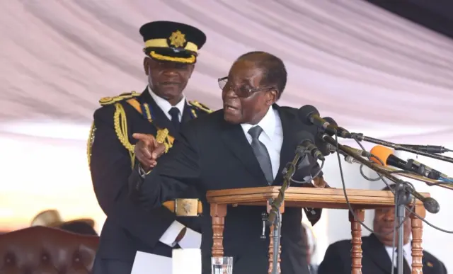 President Robert Mugabe (R) delivers a speech during the burial of liberation war hero Don Muvuti at the national heroes acre in Harare, Zimbabwe, 01 November 2017