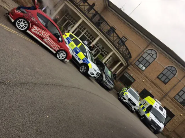 Police cars parked outside the venue