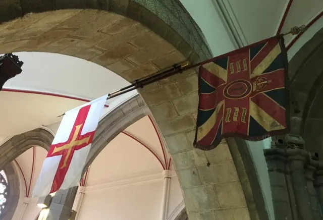 Guernsey flag and RGLI standard in the Town Church