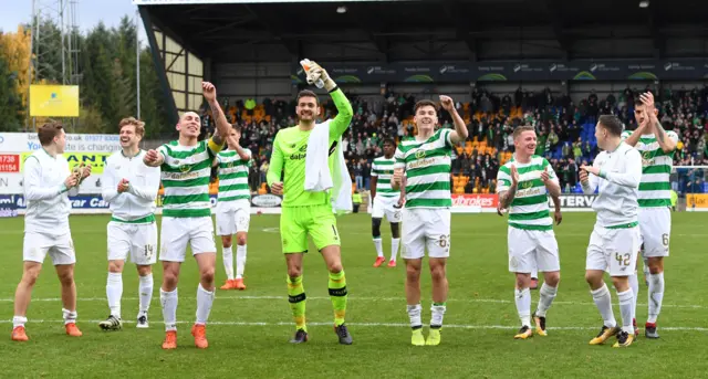 Celtic players celebrate at McDiarmid Park