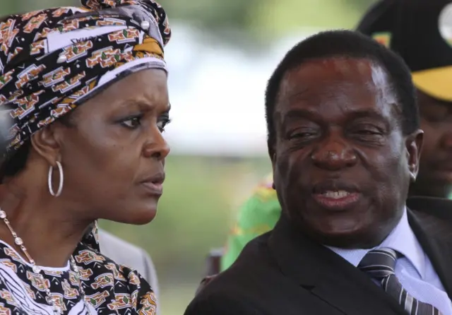 Zimbabwe's President Robert Mugabe"s wife Grace talks to Vice President Emmerson Mnangagwa at a gathering of the ZANU-PF party"s top decision making body, the Politburo, in the capital of Harare, Zimbabwe